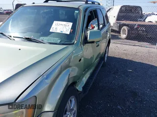 2008 Mercury Mariner Premier z VIN 4M2CU87128KJ17796, wystawiony jako IAAI lot #42296965 z przebiegiem 273 153 mil mil oraz . Historia ofert i sprzedaży dostępna na DreamBid. Obrazek 6.