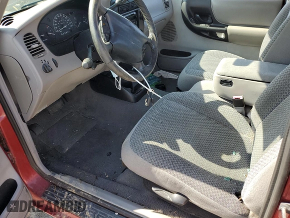 1999 Ford Ranger XL with VIN 1FTYR14V2XPA97269, listed as a Copart auction lot 52741825 with 142,302 mi miles and Salvage title. Bid and sale history available at DreamBid. Image 7.