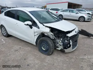 2013 Kia Rio LX with VIN KNADM4A3XD6236578, listed as a IAAI auction lot 41722410 with 174,894 mi miles. Bid and sale history available at carsss.com. Image 1.