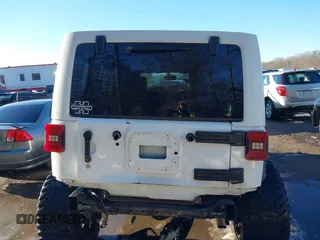 2014 Jeep Wrangler Unlimited Sahara with VIN 1C4HJWEG2EL273813, listed as a IAAI auction lot 41311011 with 96,104 mi miles. Bid and sale history available at carsss.com. Image 16.