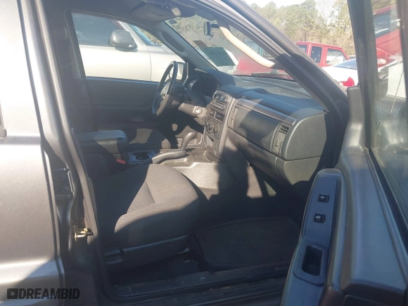 2004 Jeep Grand Cherokee Laredo with VIN 1J4GX48S44C394429, listed as a IAAI auction lot 41802203 with 144,925 mi miles. Bid and sale history available at carsss.com. Image 5.