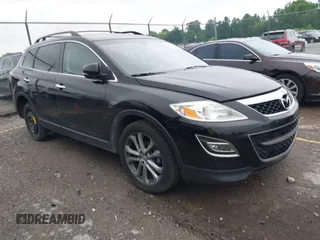 2012 Mazda CX-9 Grand Touring z VIN JM3TB2DAXC0338667, wystawiony jako IAAI lot #42260820 z przebiegiem 138 111 mil mil oraz . Historia ofert i sprzedaży dostępna na DreamBid. Obrazek 1.