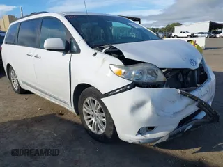 2013 Toyota Sienna XLE AAS with VIN 5TDYK3DC8DS324853, listed as a IAAI auction lot 41647704 with 143,656 mi miles and . Bid and sale history available at carsss.com. Image 1.