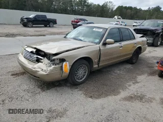 2000 Ford Crown Victoria LX z VIN 2FAFP74W7YX117705, wystawiony jako Copart lot #79226944 z przebiegiem 128 019 mil mil oraz Szkoda całkowita • Salvage title. Historia ofert i sprzedaży dostępna na DreamBid. Obrazek 1.