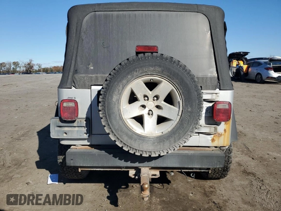 2003 Jeep Wrangler Rubicon z VIN 1J4FA69SX3P301962, wystawiony jako Copart lot #79928744 z przebiegiem Nie podano mil oraz Czysty tytuł • Clean title. Historia ofert i sprzedaży dostępna na DreamBid. Obrazek 6.