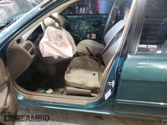 1996 Toyota Tercel DX z VIN JT2BC52L7T7044201, wystawiony jako Copart lot #77190074 z przebiegiem Nie podano mil oraz Szkoda całkowita • Salvage title. Historia ofert i sprzedaży dostępna na DreamBid. Obrazek 7.