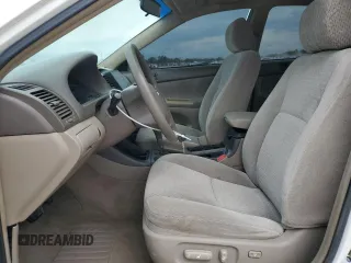 2004 Toyota Camry LE with VIN 4T1BE32K14U285392, listed as a Copart auction lot 48312415 with 121,629 mi miles and Salvage Title. Bid and sale history available at DreamBid. Image 7.