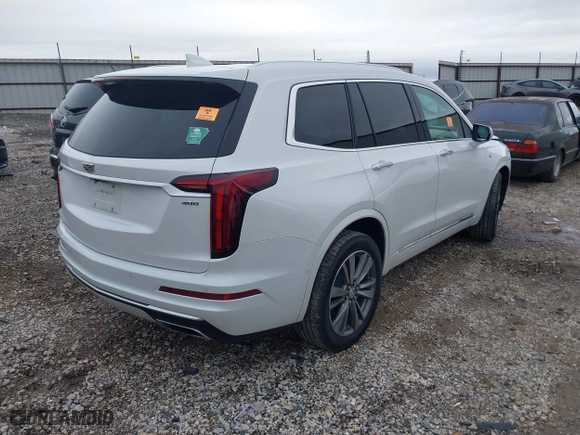 2021 Cadillac XT6 Premium Luxury with VIN 1GYKPFRS0MZ100879, listed as a IAAI auction lot 41083030 with 56,502 mi miles. Bid and sale history available at carsss.com. Image 4.