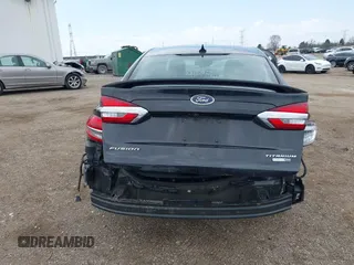 2020 Ford Fusion Titanium with VIN 3FA6P0D9XLR174523, listed as a IAAI auction lot 42100113 with 100,602 mi miles and . Bid and sale history available at DreamBid. Image 17.
