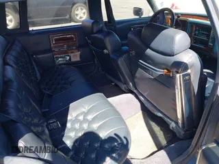 1991 Cadillac Brougham z VIN 1G6DW547XMR708197, wystawiony jako IAAI lot #42112042 z przebiegiem Nie podano mil oraz . Historia ofert i sprzedaży dostępna na DreamBid. Obrazek 8.