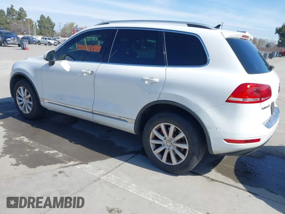2012 Volkswagen Touareg Sport with VIN WVGEF9BP5CD007294, listed as a IAAI auction lot 41841268 with 160,883 mi miles and . Bid and sale history available at DreamBid. Image 3.