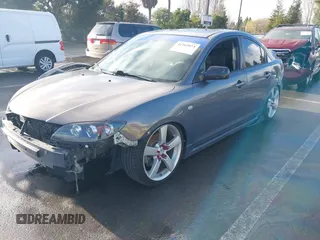 2007 Mazda 3 S Touring with VIN JM1BK324571711878, listed as a IAAI auction lot 41263973 with 158,934 mi miles and . Bid and sale history available at DreamBid. Image 2.