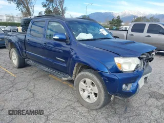 2015 Toyota Tacoma with VIN 3TMMU4FN0FM077148, listed as a IAAI auction lot 41274934 with 112,617 mi miles. Bid and sale history available at carsss.com. Image 1.