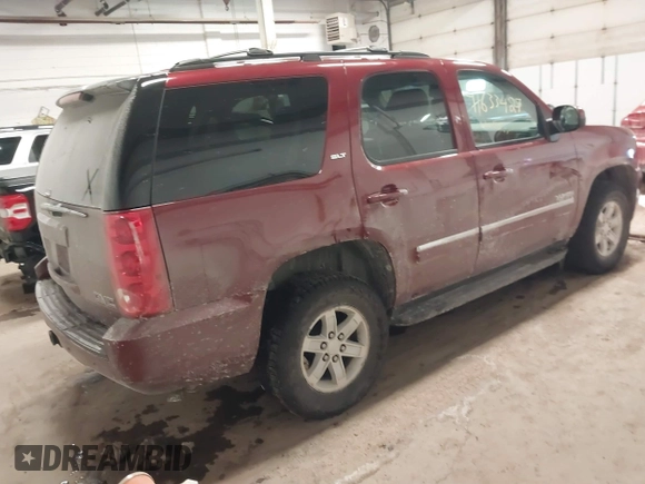 2011 GMC Yukon SLT with VIN 1GKS2CE08BR308792, listed as a IAAI auction lot 41633427 with 216,483 mi miles. Bid and sale history available at carsss.com. Image 4.