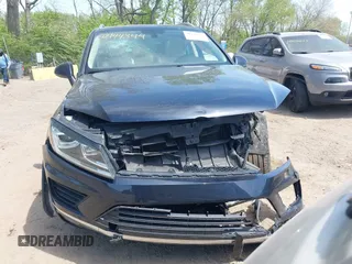 2015 Volkswagen Touareg Lux z VIN WVGEP9BP2FD007450, wystawiony jako IAAI lot #42144344 z przebiegiem 174 308 mil mil oraz . Historia ofert i sprzedaży dostępna na DreamBid. Obrazek 11.