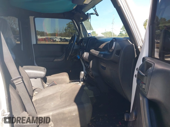 2017 Jeep Wrangler Unlimited Sport with VIN 1C4BJWDG4HL502861, listed as a IAAI auction lot 40895010 with 62,970 mi miles. Bid and sale history available at carsss.com. Image 5.