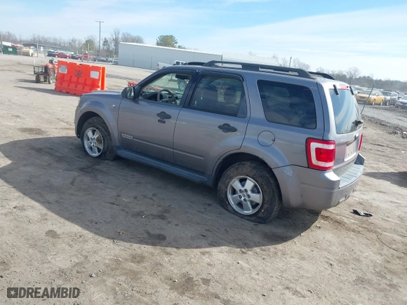 2008 Ford Escape XLT with VIN 1FMCU03178KA47527, listed as a IAAI auction lot 41672719 with 306,312 mi miles. Bid and sale history available at carsss.com. Image 3.