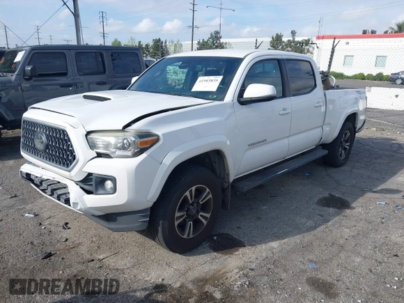 2018 Toyota Tacoma SR5 with VIN 3TMBZ5DN7JM016650, listed as a IAAI auction lot 41903835 with 105,123 mi miles and . Bid and sale history available at DreamBid. Image 2.