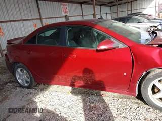 2009 Pontiac G6 1SB with VIN 1G2ZJ57KX94259078, listed as a IAAI auction lot 41223904 with 129,681 mi miles and . Bid and sale history available at DreamBid. Image 14.