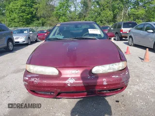 2002 Oldsmobile Alero GL1 z VIN 1G3NL52E02C215561, wystawiony jako IAAI lot #42230290 z przebiegiem 177 176 mil mil oraz . Historia ofert i sprzedaży dostępna na DreamBid. Obrazek 13.