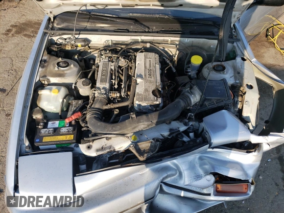 1990 Nissan 240SX z VIN JN1HS36P0LW121487, wystawiony jako Copart lot #70670904 z przebiegiem 123 794 mil mil oraz Szkody całkowita. Historia ofert i sprzedaży dostępna na DreamBid. Obrazek 11.