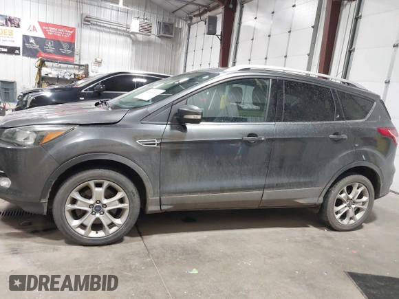 2016 Ford Escape Titanium with VIN 1FMCU9J93GUC39933, listed as a IAAI auction lot 42616323 with 116,482 mi miles and . Bid and sale history available at DreamBid. Image 14.
