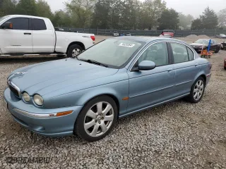 2004 Jaguar X-Type with VIN SAJEA51C04WD73149, listed as a Copart auction lot 74020364 with 118,034 mi miles and Salvage Title. Bid and sale history available at carsss.com. Image 1.