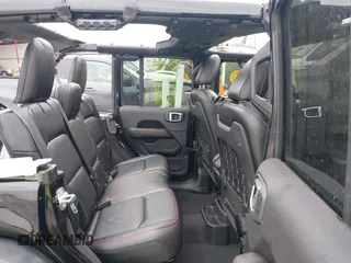 2021 Jeep Wrangler Unlimited Rubicon with VIN 1C4HJXFG7MW662092, listed as a IAAI auction lot 42139521 with 32,055 mi miles and . Bid and sale history available at carsss.com. Image 8.