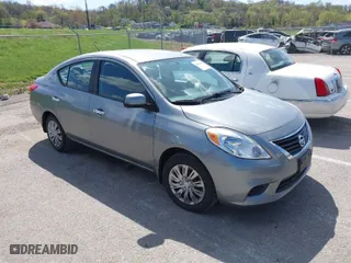 2012 Nissan Versa SL with VIN 3N1CN7AP7CL921404, listed as a IAAI auction lot 42044819 with 126,942 mi miles. Bid and sale history available at carsss.com. Image 1.