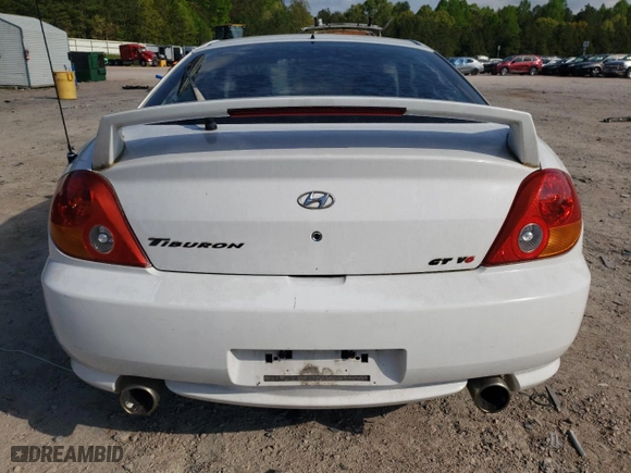2004 Hyundai Tiburon GT with VIN KMHHN65F84U149299, listed as a Copart auction lot 73946344 with 186,198 mi miles and Non Repairable. Bid and sale history available at carsss.com. Image 6.