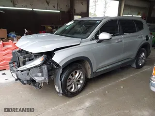 2019 Hyundai Santa Fe SE with VIN 5NMS23AD9KH035161, listed as a IAAI auction lot 41757044 with 124,835 mi miles. Bid and sale history available at carsss.com. Image 2.
