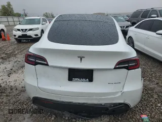 2020 Tesla Model Y Long Range z VIN 5YJYGDEE4LF052702, wystawiony jako Copart lot #53243385 z przebiegiem 75 917 mil mil oraz Szkoda całkowita • Salvage title. Historia ofert i sprzedaży dostępna na DreamBid. Obrazek 6.