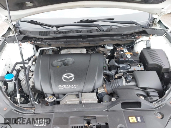 2016 Mazda CX-5 Grand Touring z VIN JM3KE4DY0G0705884, wystawiony jako IAAI lot #42016910 z przebiegiem 73 324 mil mil oraz . Historia ofert i sprzedaży dostępna na DreamBid. Obrazek 10.