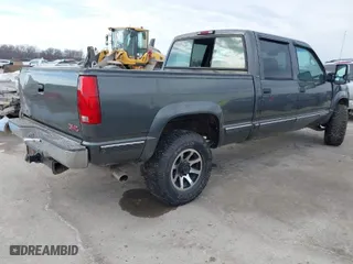 1999 GMC Sierra 2500 Crew Cab with VIN 1GTGK23R3XF050476, listed as a IAAI auction lot 41630143 with 158,655 mi miles. Bid and sale history available at carsss.com. Image 4.