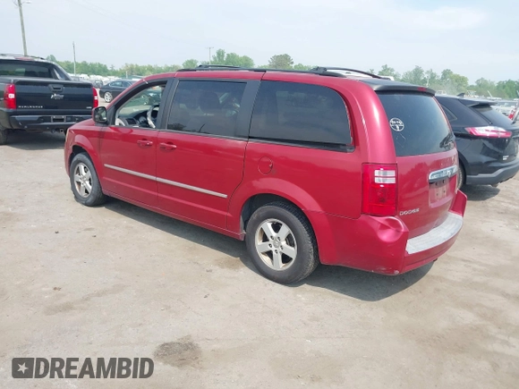 2010 Dodge Grand Caravan SXT with VIN 2D4RN5D17AR145958, listed as a IAAI auction lot 42125450 with 229,790 mi miles and . Bid and sale history available at DreamBid. Image 3.