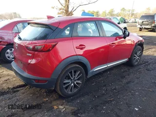 2017 Mazda CX-3 Grand Touring with VIN JM1DKFD77H0165528, listed as a IAAI auction lot 40942595 with 89,648 mi miles. Bid and sale history available at carsss.com. Image 4.