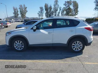 2016 Mazda CX-5 Sport with VIN JM3KE2BY9G0879654, listed as a IAAI auction lot 41819154 with 65,586 mi miles. Bid and sale history available at carsss.com. Image 14.