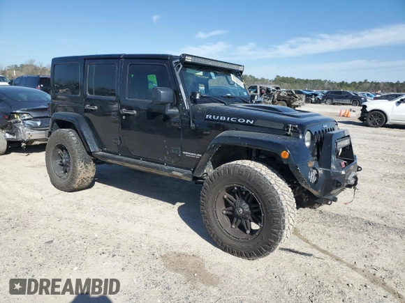 2015 Jeep Wrangler Unlimited Rubicon Hard Rock with VIN 1C4HJWFG1FL710264, listed as a Copart auction lot 47563975 with 96,737 mi miles and Salvage title. Bid and sale history available at DreamBid. Image 4.