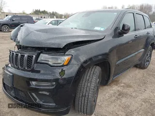 2021 Jeep Grand Cherokee 80th Anniversary with VIN 1C4RJFBG7MC828116, listed as a IAAI auction lot 42118355 with 57,240 mi miles and . Bid and sale history available at DreamBid. Image 18.