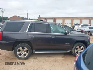 2016 Chevrolet Tahoe LTZ z VIN 1GNSKCKC3GR112445, wystawiony jako IAAI lot #42312996 z przebiegiem 107 511 mil mil oraz . Historia ofert i sprzedaży dostępna na DreamBid. Obrazek 13.