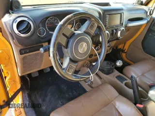 2012 Jeep Wrangler Rubicon with VIN 1C4BJWCG2CL135789, listed as a Copart auction lot 42556365 with 121,908 mi miles and Salvage title. Bid and sale history available at DreamBid. Image 8.