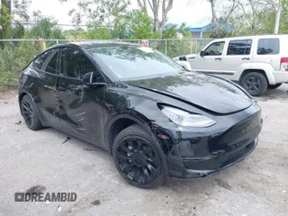 2023 Tesla Model Y Long Range with VIN 7SAYGAEE8PF928923, listed as a IAAI auction lot 41880988 with 18,468 mi miles. Bid and sale history available at carsss.com. Image 1.
