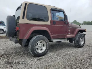 2001 Jeep Wrangler Sahara z VIN 1J4FA59SX1P305100, wystawiony jako Copart lot #58606685 z przebiegiem 76 856 mil mil oraz Czysty tytuł • Clean title. Historia ofert i sprzedaży dostępna na DreamBid. Obrazek 3.