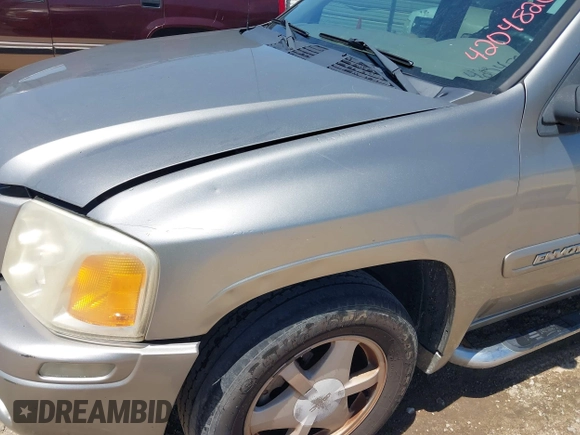 2003 GMC Envoy SLT with VIN 1GKDS13S732150215, listed as a IAAI auction lot 42048209 with 329,719 mi miles. Bid and sale history available at carsss.com. Image 6.