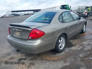 2003 Ford Taurus SE Standard with VIN 1FAFP53U63G125751, listed as a IAAI auction lot 41933803 with 196,710 mi miles. Bid and sale history available at carsss.com. Image 4.