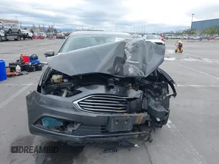 2018 Ford Fusion SE z VIN 3FA6P0LU8JR195096, wystawiony jako IAAI lot #41494088 z przebiegiem 114 007 mil mil oraz . Historia ofert i sprzedaży dostępna na DreamBid. Obrazek 13.