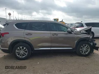 2019 Hyundai Santa Fe SE z VIN 5NMS23AD2KH014037, wystawiony jako IAAI lot #42110778 z przebiegiem 48 975 mil mil oraz . Historia ofert i sprzedaży dostępna na DreamBid. Obrazek 14.