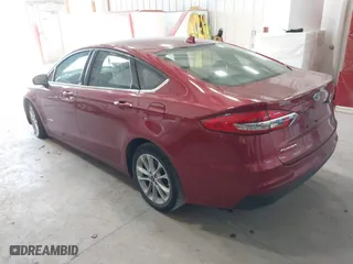 2019 Ford Fusion Hybrid SE with VIN 3FA6P0LUXKR205712, listed as a IAAI auction lot 41267049 with 124,687 mi miles. Bid and sale history available at carsss.com. Image 3.