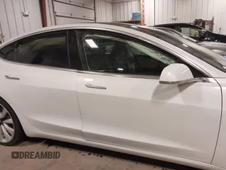 2018 Tesla Model 3 Long Range Battery with VIN 5YJ3E1EB5JF084446, listed as a IAAI auction lot 41209852 with 70,125 mi miles and . Bid and sale history available at DreamBid. Image 14.