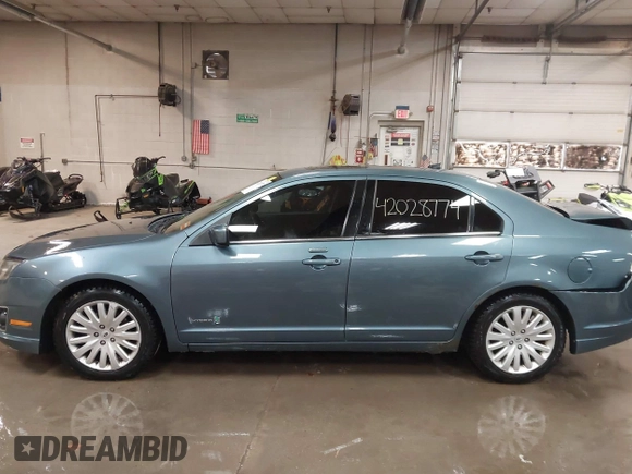 2012 Ford Fusion Hybrid z VIN 3FADP0L31CR443545, wystawiony jako IAAI lot #42028774 z przebiegiem 194 365 mil mil oraz . Historia ofert i sprzedaży dostępna na DreamBid. Obrazek 14.